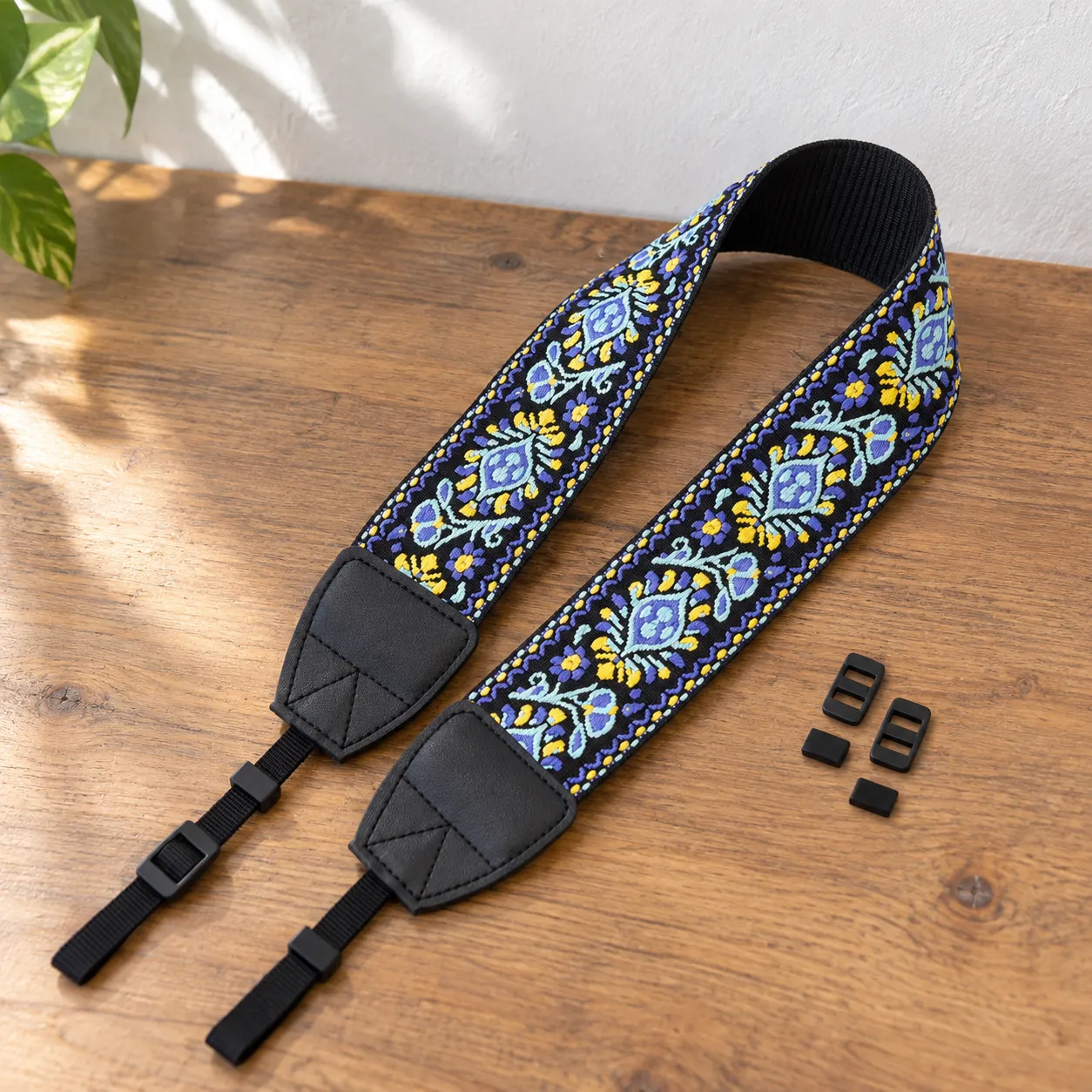 blue embroidered camera neck strap: lead view