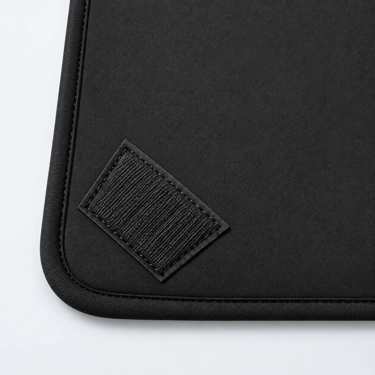 Close view of the large black wrap corner and fastening patch
