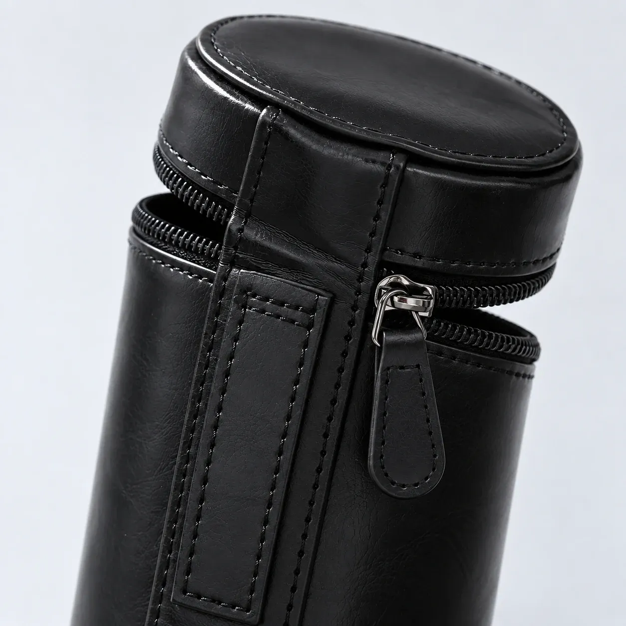 Close view of the compact case side stitching and zipper